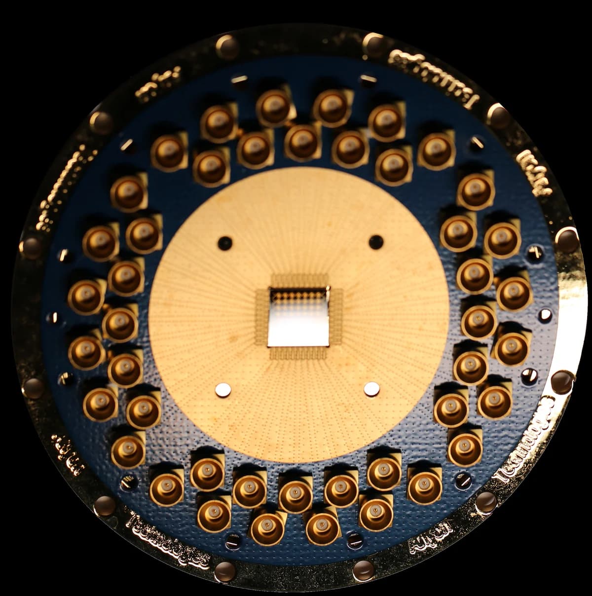 Anyon superconducting quantum processor — a gold-plated modular chiplet package ringed with microwave connectors